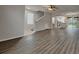 Open-concept living room boasts modern hardwood flooring and abundant natural light at 13640 Forest Lake Dr, Largo, FL 33771