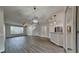 Beautiful open-concept featuring hardwood flooring, updated lighting, and plenty of space at 13640 Forest Lake Dr, Largo, FL 33771