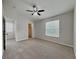 Serene main bedroom features plush carpeting, neutral walls, and ample natural light at 13640 Forest Lake Dr, Largo, FL 33771