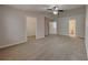 Expansive main bedroom with neutral carpeting, ceiling fan, and walk-in closet at 13640 Forest Lake Dr, Largo, FL 33771
