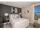 Stylish bedroom featuring a white bed frame, decorative skateboards, and modern interior design at 13722 Heartwood Way, Parrish, FL 34219