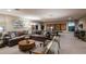 Spacious game room featuring a comfortable sectional, ping pong table, and stylish decor at 13722 Heartwood Way, Parrish, FL 34219