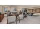 A Gathering game room features neutral walls, comfortable sectional seating, and fun ping pong table at 13722 Heartwood Way, Parrish, FL 34219