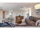 The comfortable living room showcases modern furniture, a neutral color scheme, and a carpeted floor at 13722 Heartwood Way, Parrish, FL 34219