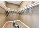 Walk-in closet with ample shelving and storage, complete with stylish seating at 13726 Heartwood Way, Parrish, FL 34219