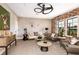 Comfortable living room with brick wall, stylish furnishings, and natural light at 13726 Heartwood Way, Parrish, FL 34219