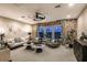 Cozy living room with a brick accent wall, modern decor, and ample seating at 13726 Heartwood Way, Parrish, FL 34219