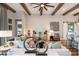 Cozy living room with wood beam ceilings, stylish decor, and an open view to other rooms at 13726 Heartwood Way, Parrish, FL 34219