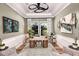 Stylish home office with unique decor, custom ceiling, and ample natural light at 13726 Heartwood Way, Parrish, FL 34219