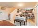 Dining area view to kitchen, stairs, and sliding doors at 14560 Haddon Mist Dr, Wimauma, FL 33598