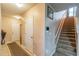 Spacious foyer leads to stairs, front door, and access to the rest of the home at 14560 Haddon Mist Dr, Wimauma, FL 33598