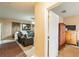 Open-concept floorplan showing living room with couch at 14560 Haddon Mist Dr, Wimauma, FL 33598