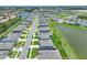 An aerial view of the house along a street, near a pond, offering a serene environment and scenic beauty at 152 Bright Ibis Ave, Apollo Beach, FL 33572