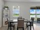 Bright dining space featuring modern table setting and tranquil view at 152 Bright Ibis Ave, Apollo Beach, FL 33572