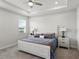 Bright primary bedroom with tray ceiling, soft lighting, and elegant decor at 152 Bright Ibis Ave, Apollo Beach, FL 33572
