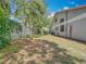 The backyard has a lawn and fence at 1556 Lynda Ln, Dunedin, FL 34698