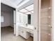 Classic bathroom design featuring large vanity with a built-in cabinet and shelving at 1556 Lynda Ln, Dunedin, FL 34698