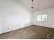 Neutral bedroom with ceiling fan and a bright window at 1556 Lynda Ln, Dunedin, FL 34698