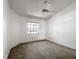 Cozy bedroom with a ceiling fan and window for natural light at 1556 Lynda Ln, Dunedin, FL 34698
