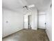 The bedroom includes a ceiling fan, closet, and ensuite bathroom at 1556 Lynda Ln, Dunedin, FL 34698