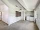Spacious room with ceiling fan and convenient in-unit laundry closet at 1556 Lynda Ln, Dunedin, FL 34698