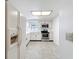 Kitchen featuring white cabinetry and stainless steel appliances at 1556 Lynda Ln, Dunedin, FL 34698