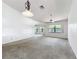 Spacious living room with ceiling fan and lots of natural light at 1556 Lynda Ln, Dunedin, FL 34698