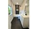 Modern bathroom features a shower-tub combo, contrasting black and white tile, and sleek vanity at 1675 13Th S Ave, St Petersburg, FL 33712