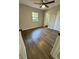 Bright bedroom with hardwood floors, closet, and a ceiling fan at 1675 13Th S Ave, St Petersburg, FL 33712