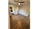 Bedroom with hardwood floors leading to ensuite bathroom at 1675 13Th S Ave, St Petersburg, FL 33712