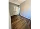 Cozy bedroom features wood-look flooring, gray walls, and a double door closet at 1675 13Th S Ave, St Petersburg, FL 33712