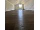 Bright bonus room with wood floors, white walls, and a window for natural light at 1675 13Th S Ave, St Petersburg, FL 33712