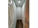 Walk-in closet with wood-look flooring, neutral walls, and overhead lighting at 1675 13Th S Ave, St Petersburg, FL 33712