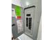 View of the gray electrical panel, offering electrical service and safety features at 1675 13Th S Ave, St Petersburg, FL 33712