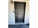 Close-up of the stylish front door featuring modern hardware and design elements at 1675 13Th S Ave, St Petersburg, FL 33712