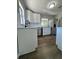 Stylish kitchen with white cabinets, stainless steel appliances, and modern lighting at 1675 13Th S Ave, St Petersburg, FL 33712
