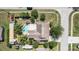 Aerial shot of a single-Gathering home with pool, spacious backyard, and serene surroundings at 1813 Nova Dr, Valrico, FL 33596