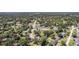 Expansive aerial view of a residential neighborhood with tree-lined streets and well-spaced homes at 1813 Nova Dr, Valrico, FL 33596