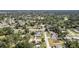 Wide aerial perspective showcases a densely populated suburban community amidst lush green foliage at 1813 Nova Dr, Valrico, FL 33596