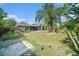 Spacious backyard with a well-maintained lawn, a inviting pool, and a private fenced yard, ideal for outdoor activities at 1813 Nova Dr, Valrico, FL 33596
