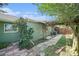 Charming backyard featuring lush greenery, a pergola, and a well-maintained lawn, offering a serene outdoor space at 1813 Nova Dr, Valrico, FL 33596
