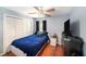Comfortable bedroom with a cozy bed, ample closet space, and a ceiling fan for added comfort at 1813 Nova Dr, Valrico, FL 33596