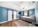 Bedroom with en-suite bathroom, walk-in closet, and a fan at 1813 Nova Dr, Valrico, FL 33596
