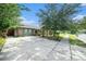 Well-maintained single-story home with long driveway and mature landscaping at 1813 Nova Dr, Valrico, FL 33596