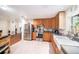 Bright kitchen with a farmhouse sink, stainless appliances, and tile flooring at 1813 Nova Dr, Valrico, FL 33596