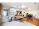 Bright kitchen with stainless steel appliances, a utility island, and a view of the dining room at 1813 Nova Dr, Valrico, FL 33596