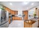 Spacious kitchen featuring stainless steel appliances, tile floors, and ample cabinet space at 1813 Nova Dr, Valrico, FL 33596
