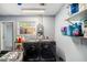 Laundry room with a pair of dark colored, front-load washing machine and clothes dryer at 1813 Nova Dr, Valrico, FL 33596