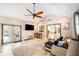 Bright living room featuring tile floors, a ceiling fan, and access to the back patio at 1813 Nova Dr, Valrico, FL 33596