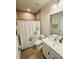 Cozy bathroom with shower-tub combination and modern vanity at 18292 Hunters Meadow Walk, Land O Lakes, FL 34638